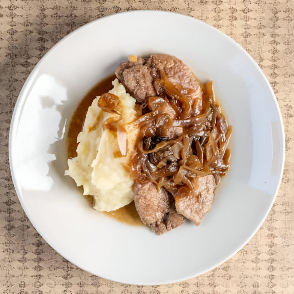 A plate of liver and onions with mashed potatoes and gravy from Rockwell's Red Lion Restaurant.