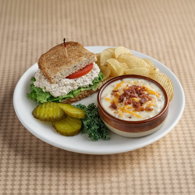 ½ Turkey, Corned Beef, Egg Salad, Or Baked Ham Sandwich & Crock of Soup.